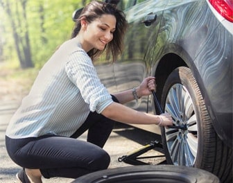 Lady changing her tire